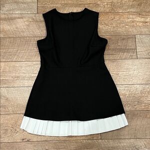 Sleeveless Black Dress with White Pleated Hem
